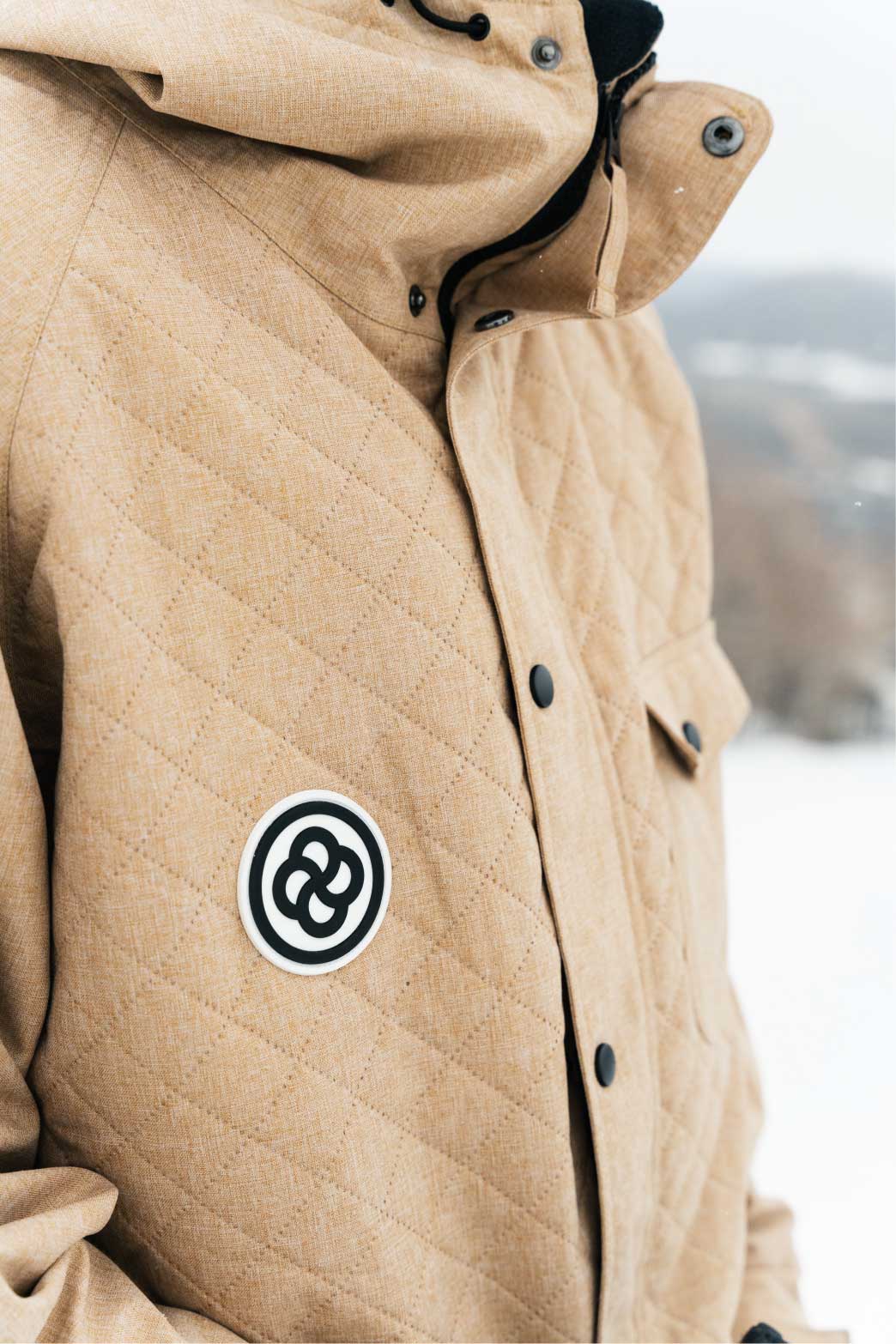 Man wearing the best budget ski jacket on mountain slope