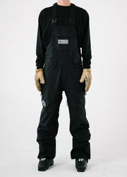 Mens black ski bib shell pant against white backdrop