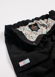 Men's black snowboard pants with colorful liner