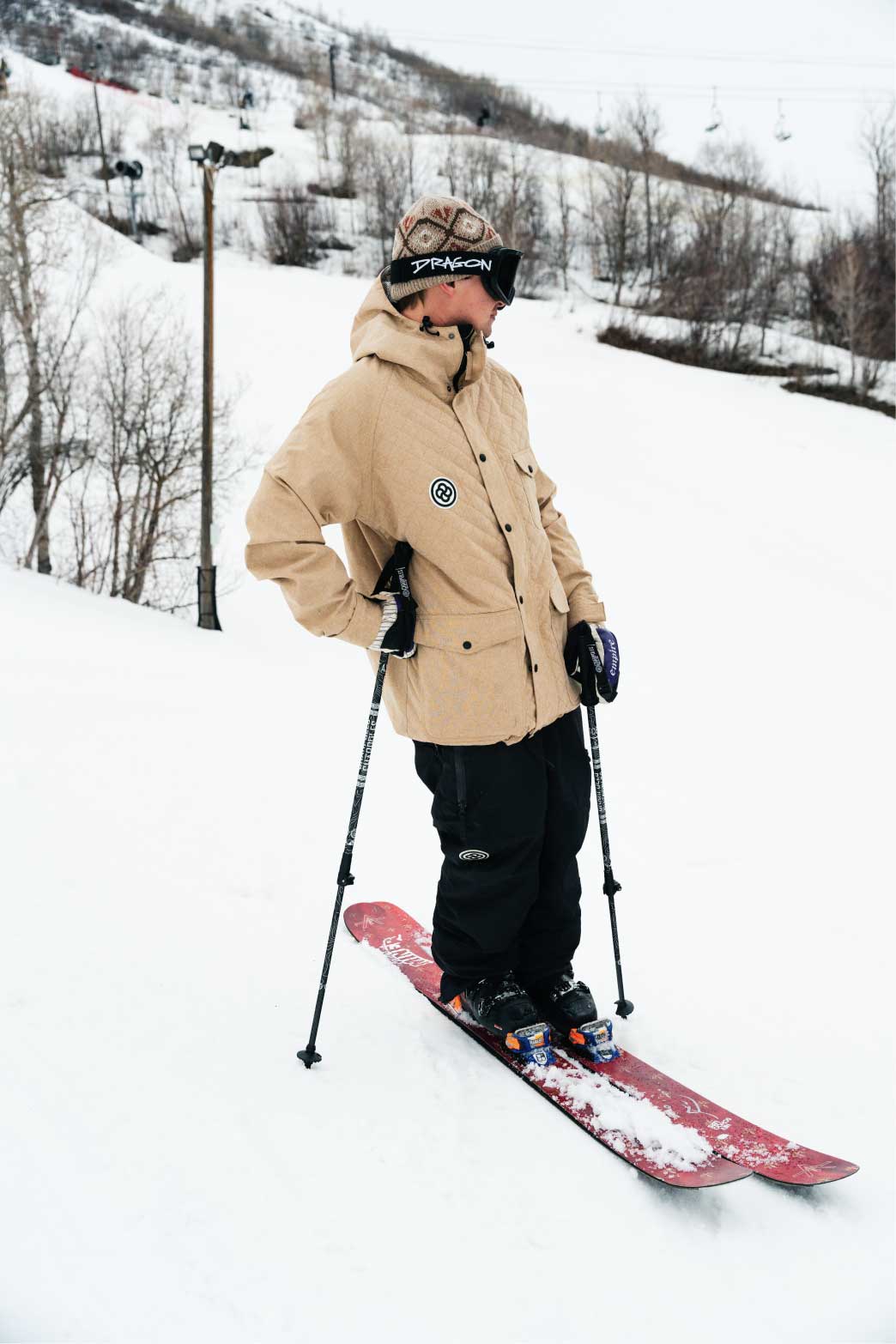 Skier stands on mountain slope wearing the best ski jacket