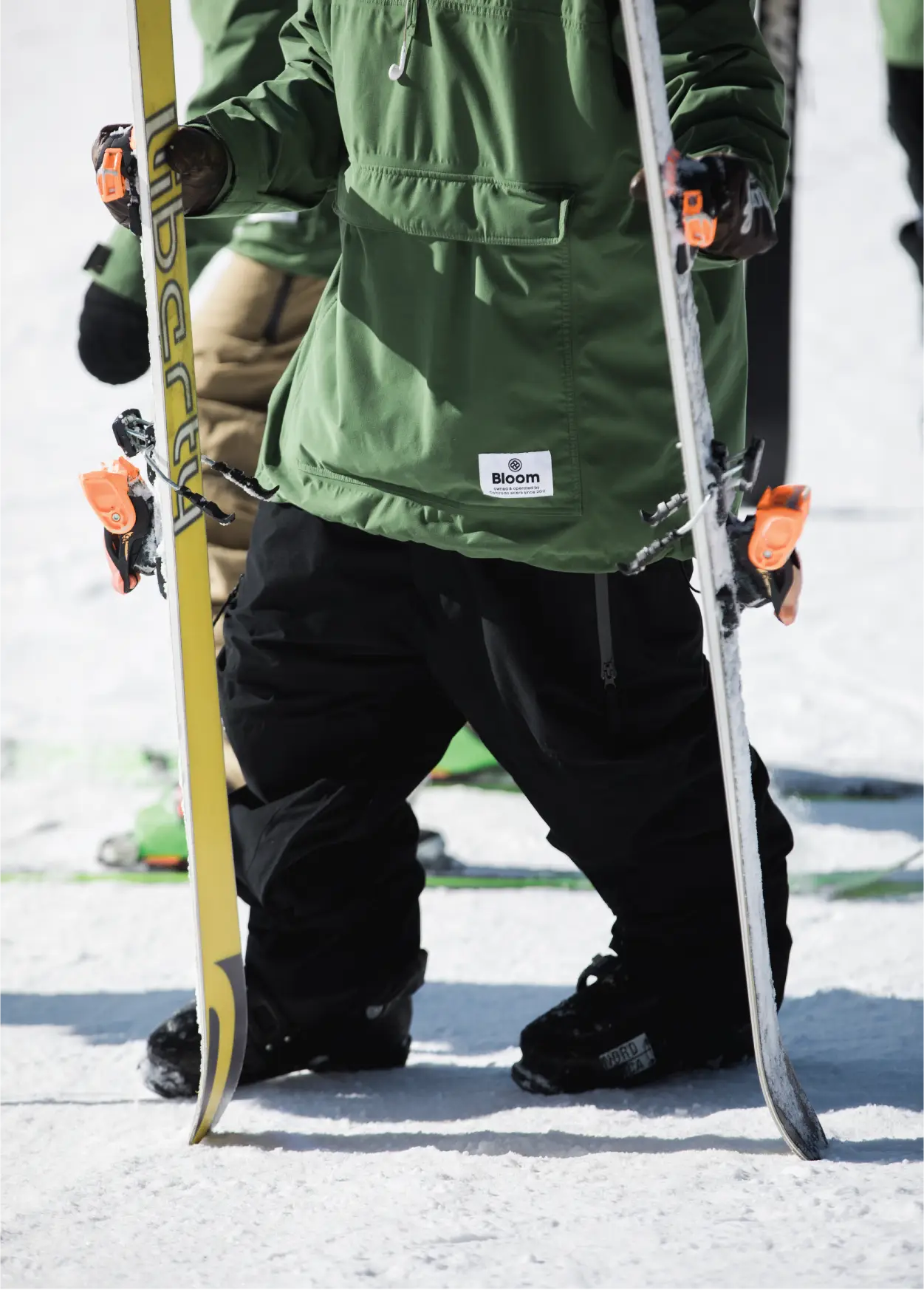 Close up shot of a black freestyle snow pants against a white backdrop