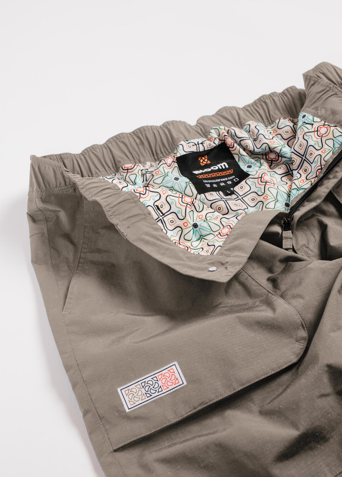 Brown snowboard pant with a psychedelic liner print