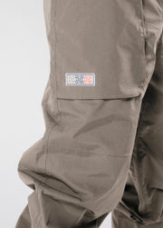 Brown baggy snowboard pants with colorful woven patch
