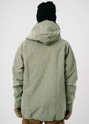 Back of cool green ski jacket against white backdrop