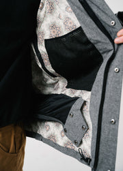 Gray ski jacket with snow skirt