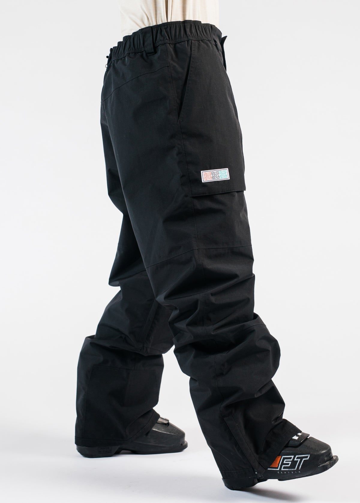 Men's black baggy ski pants, side view - Team Ski Pant