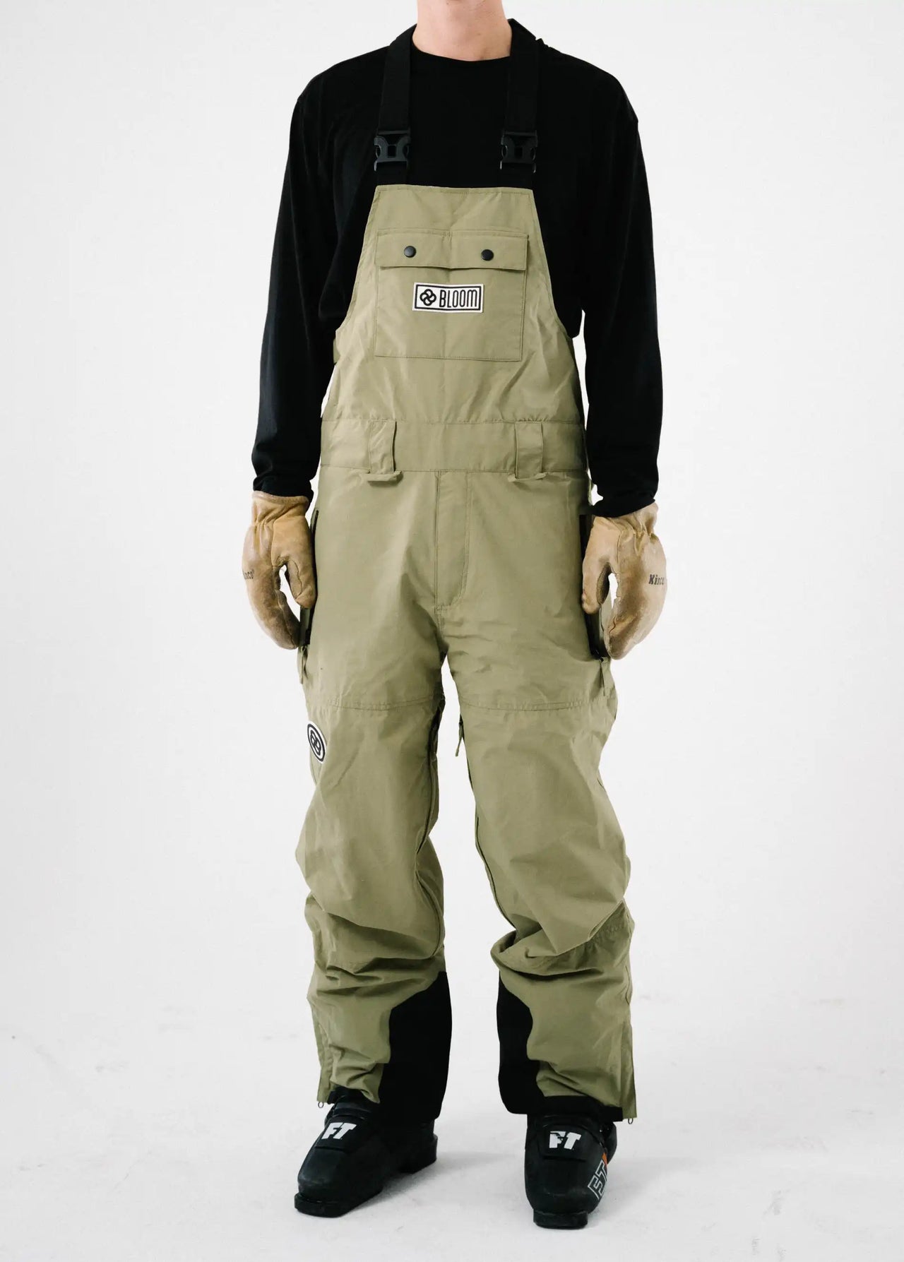 Front view of a men's green ski bib shell