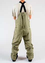 Men’s green 20K waterproof snowboard bib pants with rear pockets and adjustable suspenders.

