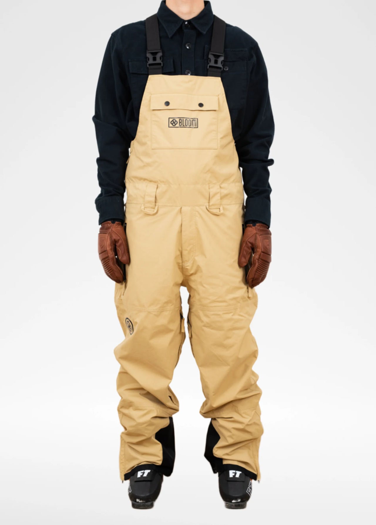 Tan ski bib for men against white backdrop