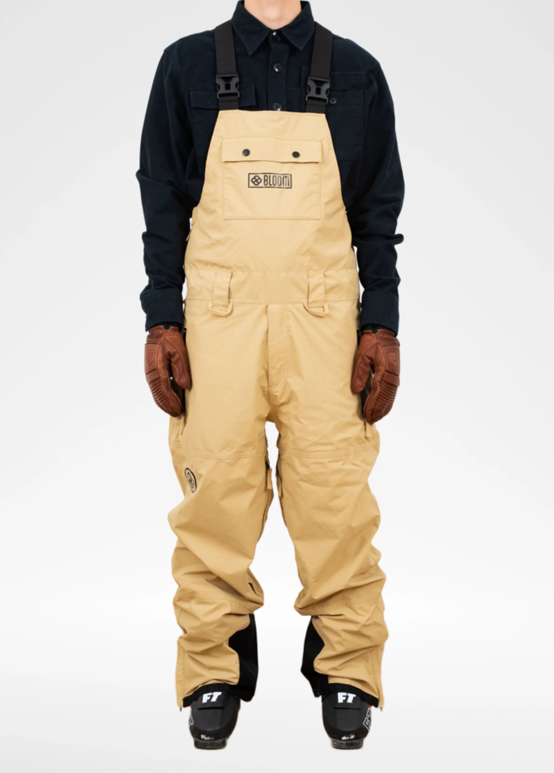 Tan ski bib for men against white backdrop