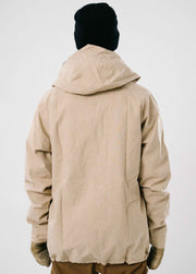 A studio photograph of the back of a waterproof mens ski jacket that is tan colore