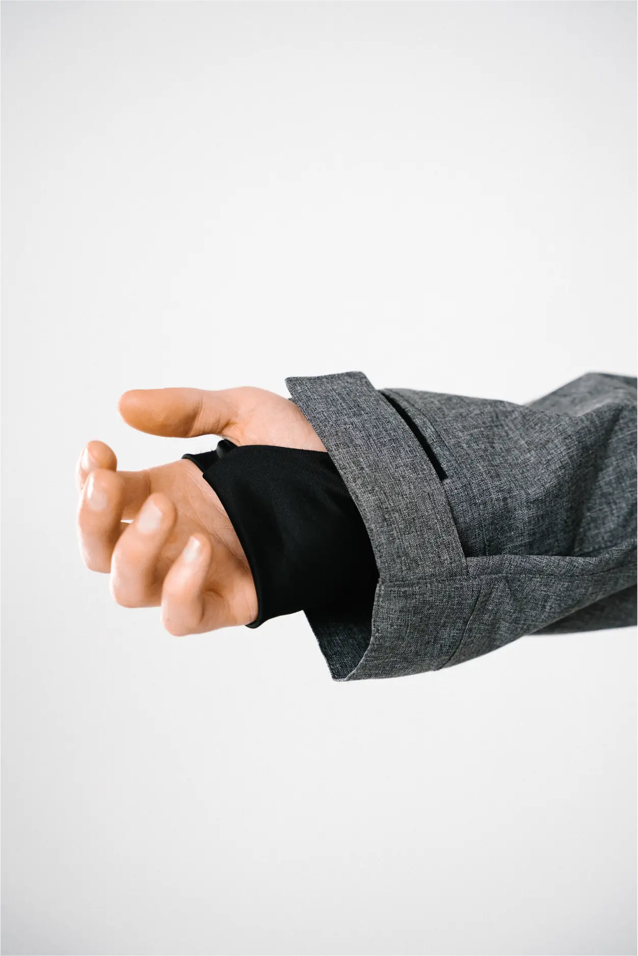 A wrist gaiter on a quilted ski jacket