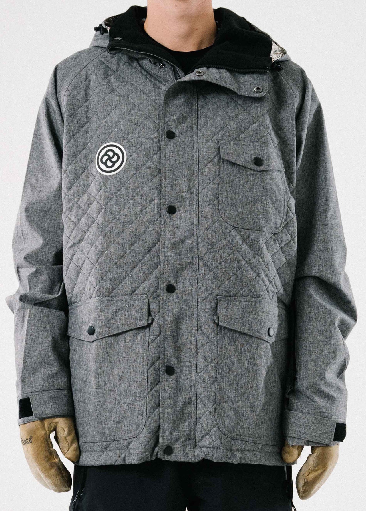 Stylish men's gray ski jacket with quilted puffer pattern and black buttons