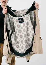 Tan ski jacket with psychedelic liner print