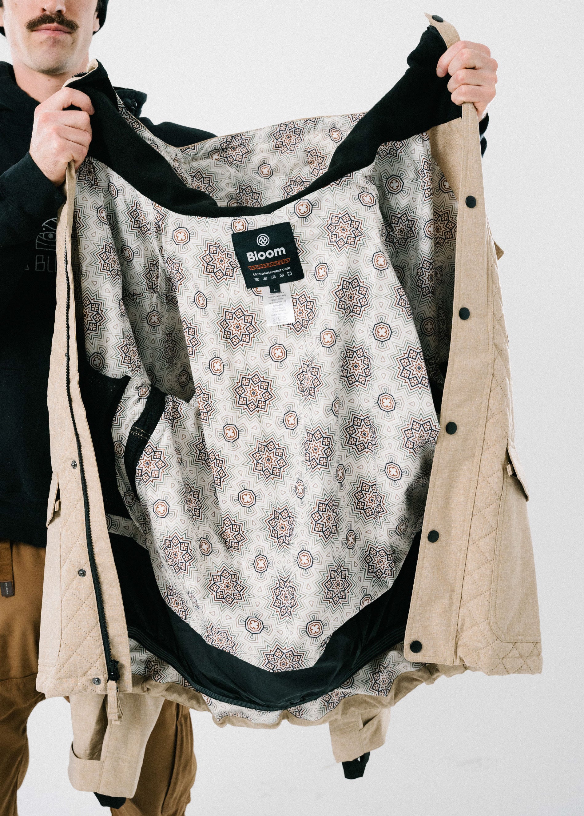 Tan ski jacket with psychedelic liner print