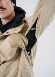 Tan ski jacket with underarm vent