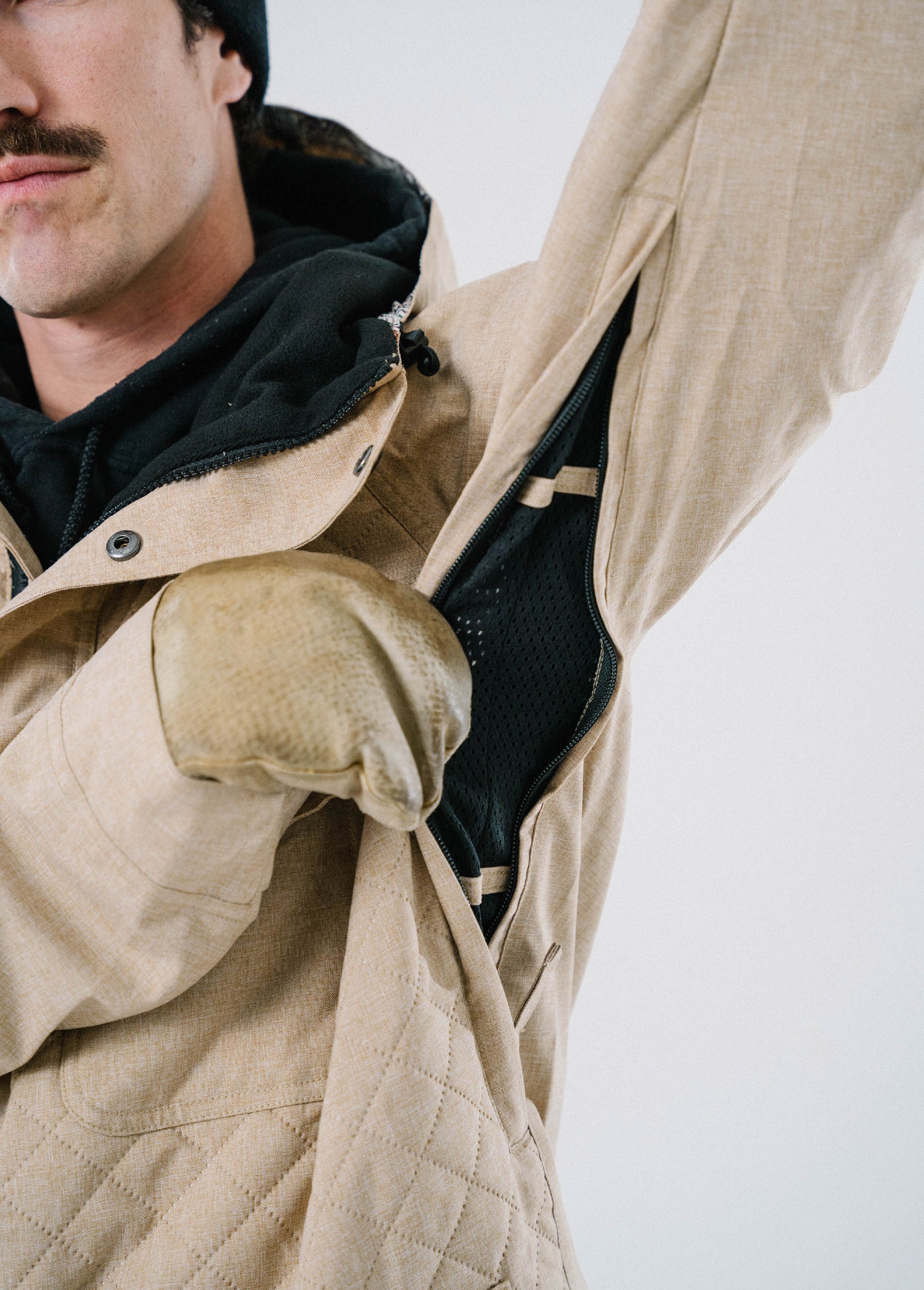 Tan ski jacket with underarm vent